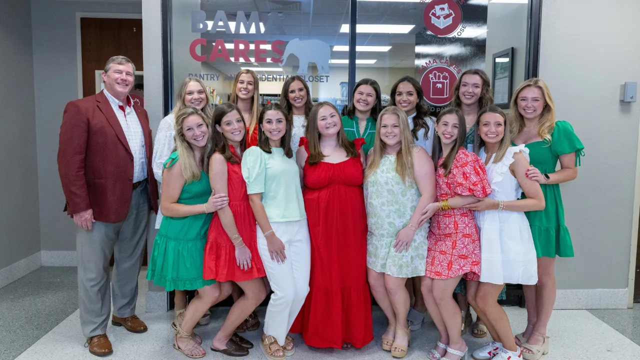 Members of Alpha Gamma Delta outside of Bama Cares Food Pantry