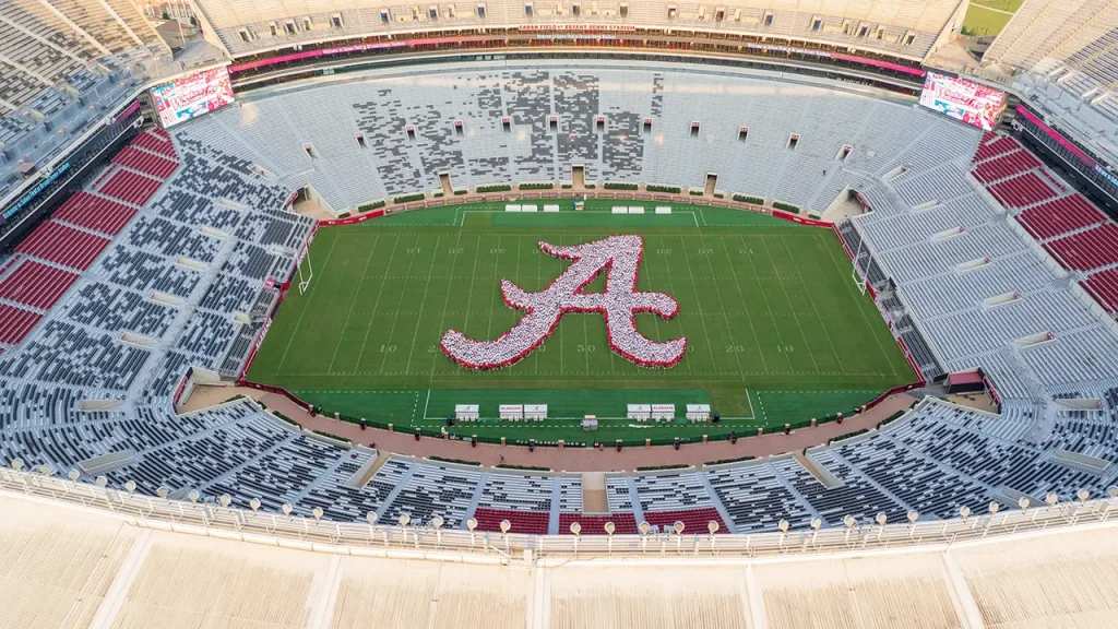 An aerial view of Saban Field at Bryant-Denny Stadium as students take part in the Script A photo.